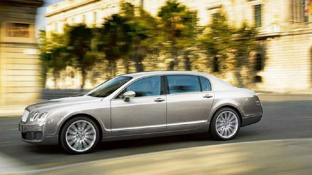 A metallic 2008 Bentley Continental Flying Spur Speed driving in left profile view