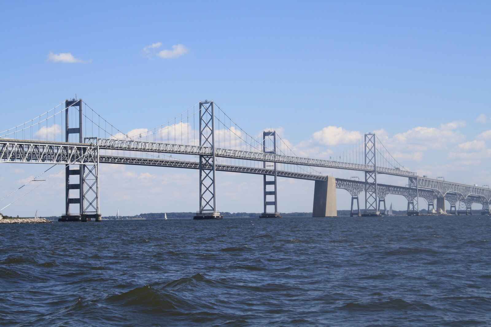 The Chesapeake Bay Bridge shown in profile view with bay waters in foreground