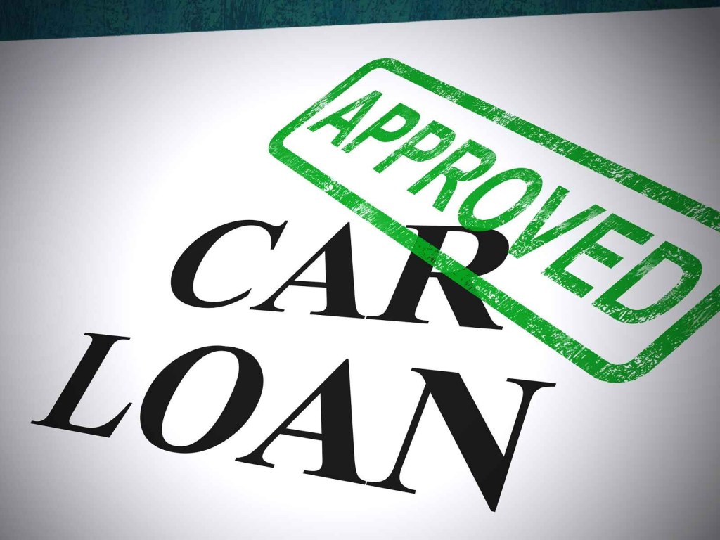 A sheet of paper with "CAR LOAN APPROVED" in large bold lettering