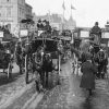 A black and white image of London traffic circa 1870 featuring horse drawn carriages and pedestrians