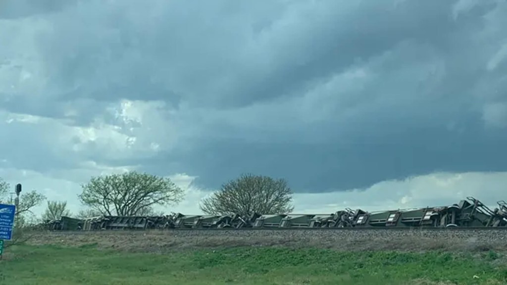 A tornado causes a train derailment.
