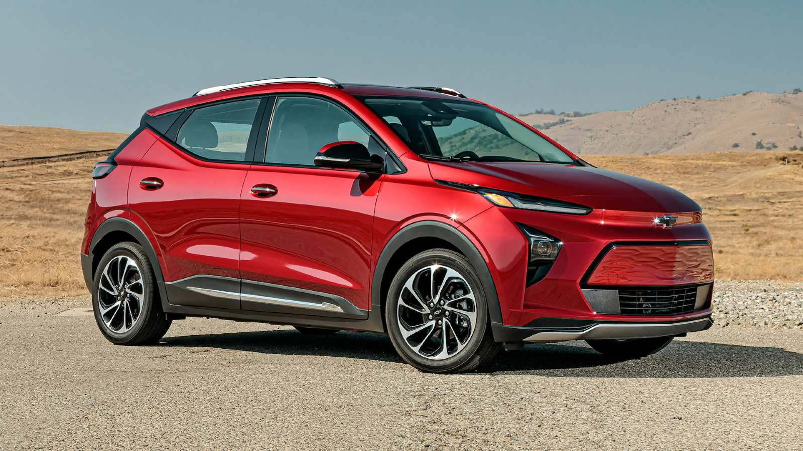 Red 2022 Chevy Bolt EUV posed on dirt.
