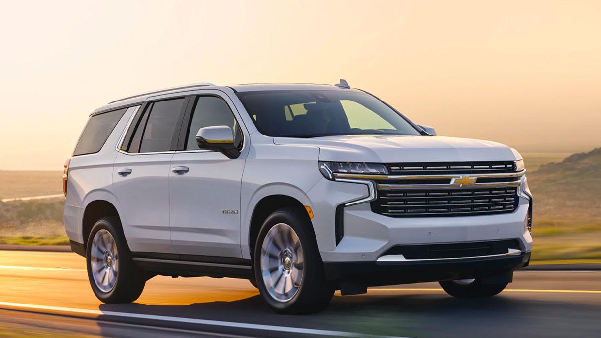A 2022 Chevy Tahoe driving down the road