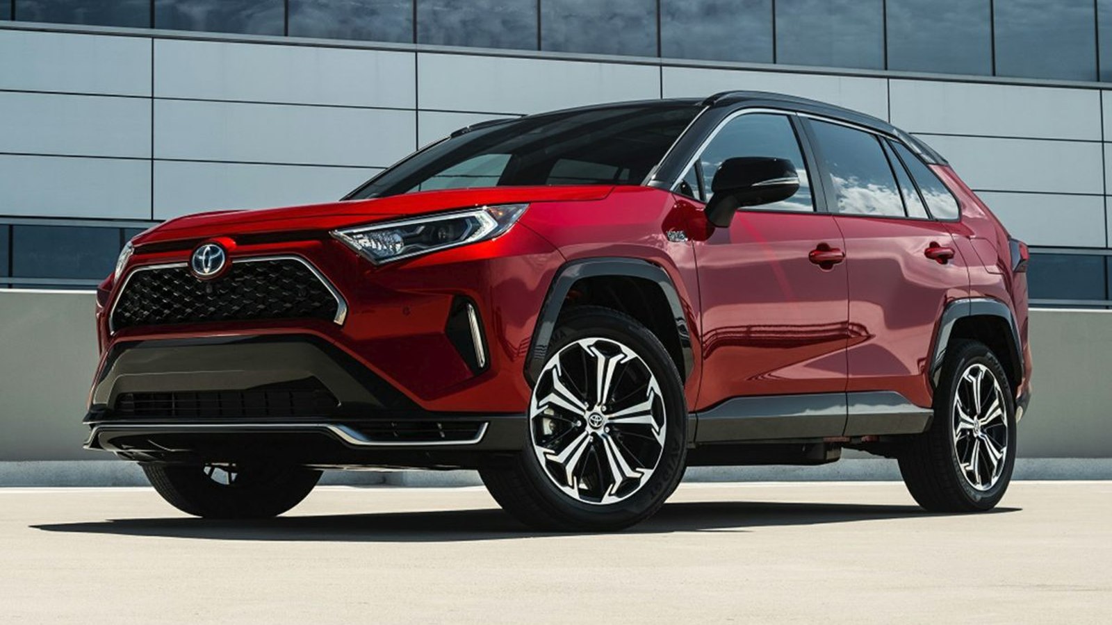 Red 2024 Toyota RAV4 Prime posed.