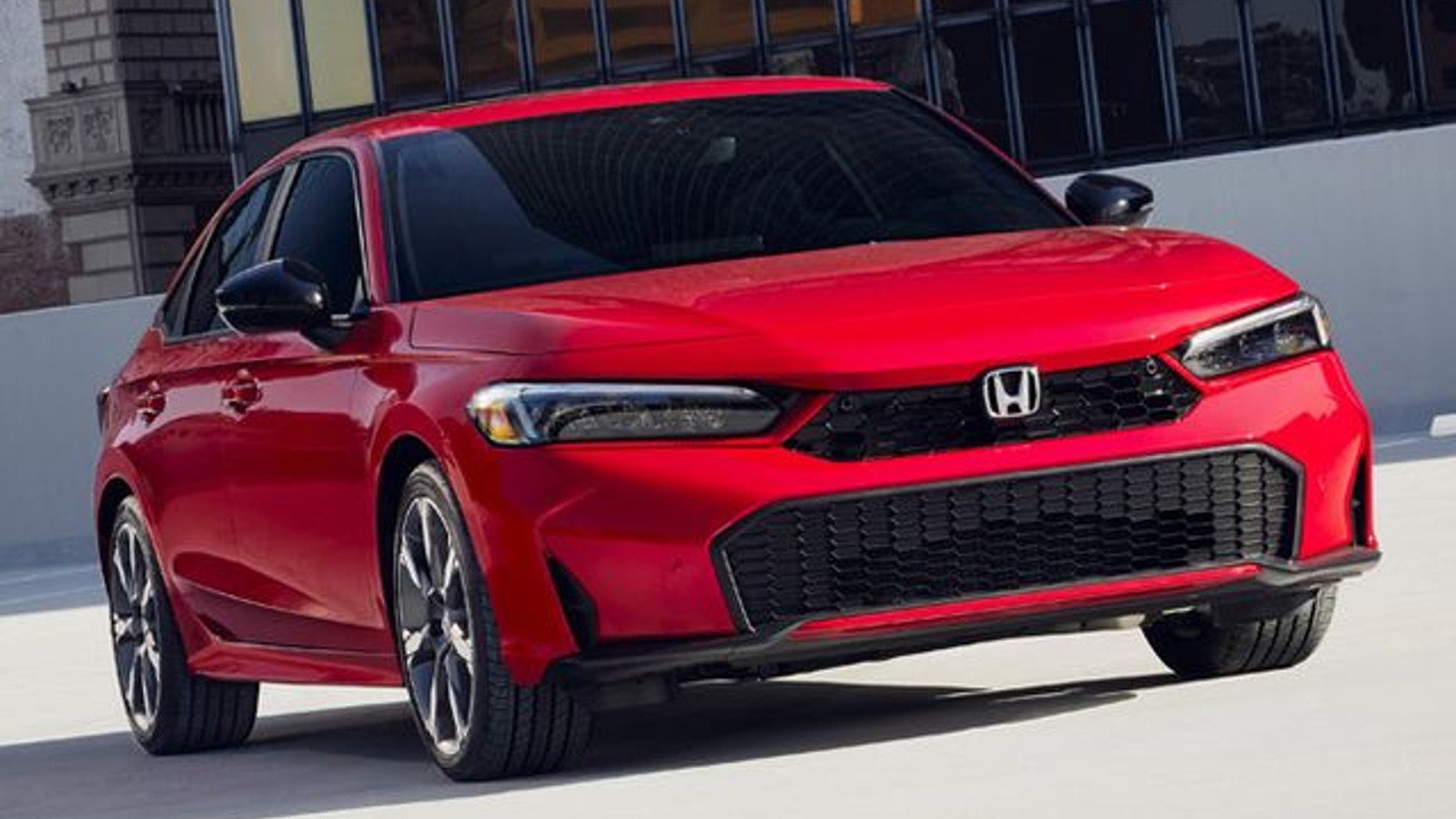 Red 2025 Honda Civic Hybrid posed