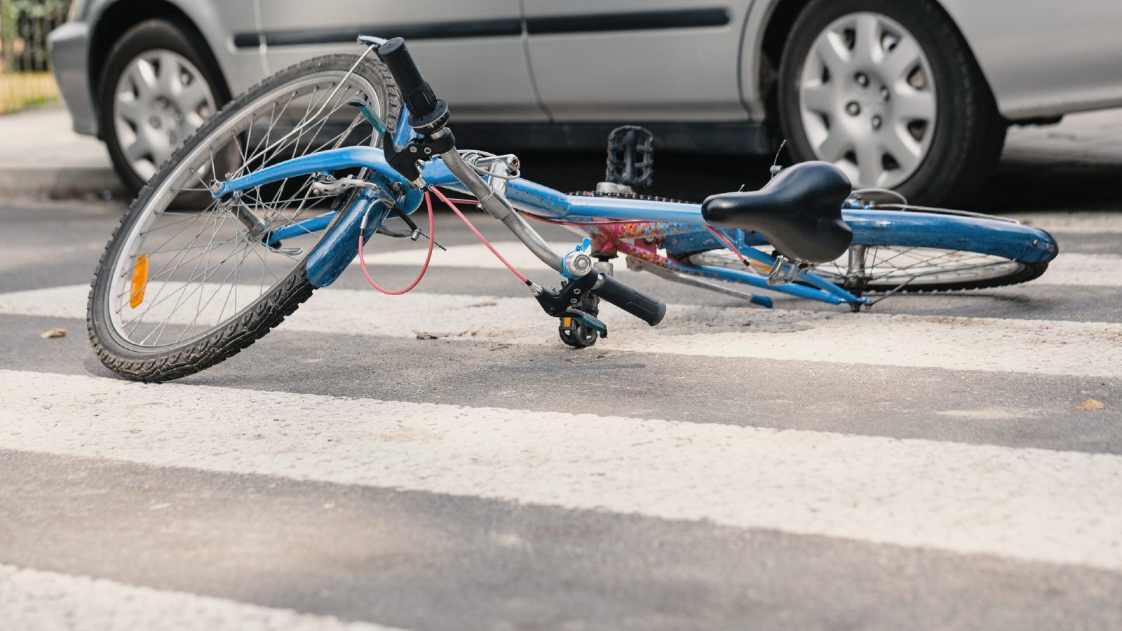 Blue Bicycle in Crosswalk