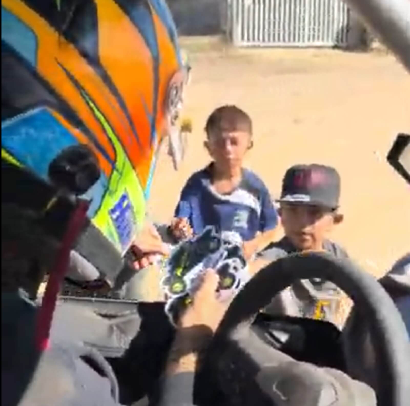 Polaris Factory Racing driver Brock Heger passes out stickers in Ojos Negros.