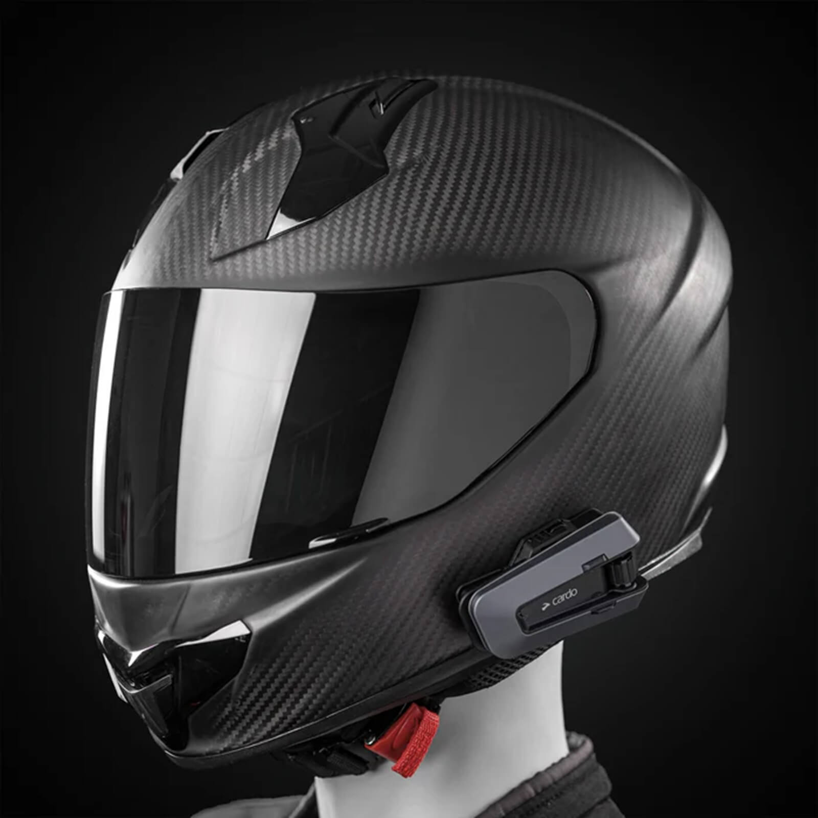A Cardo Packtalk Edge Bluetooth system for a motorcycle helmet. 