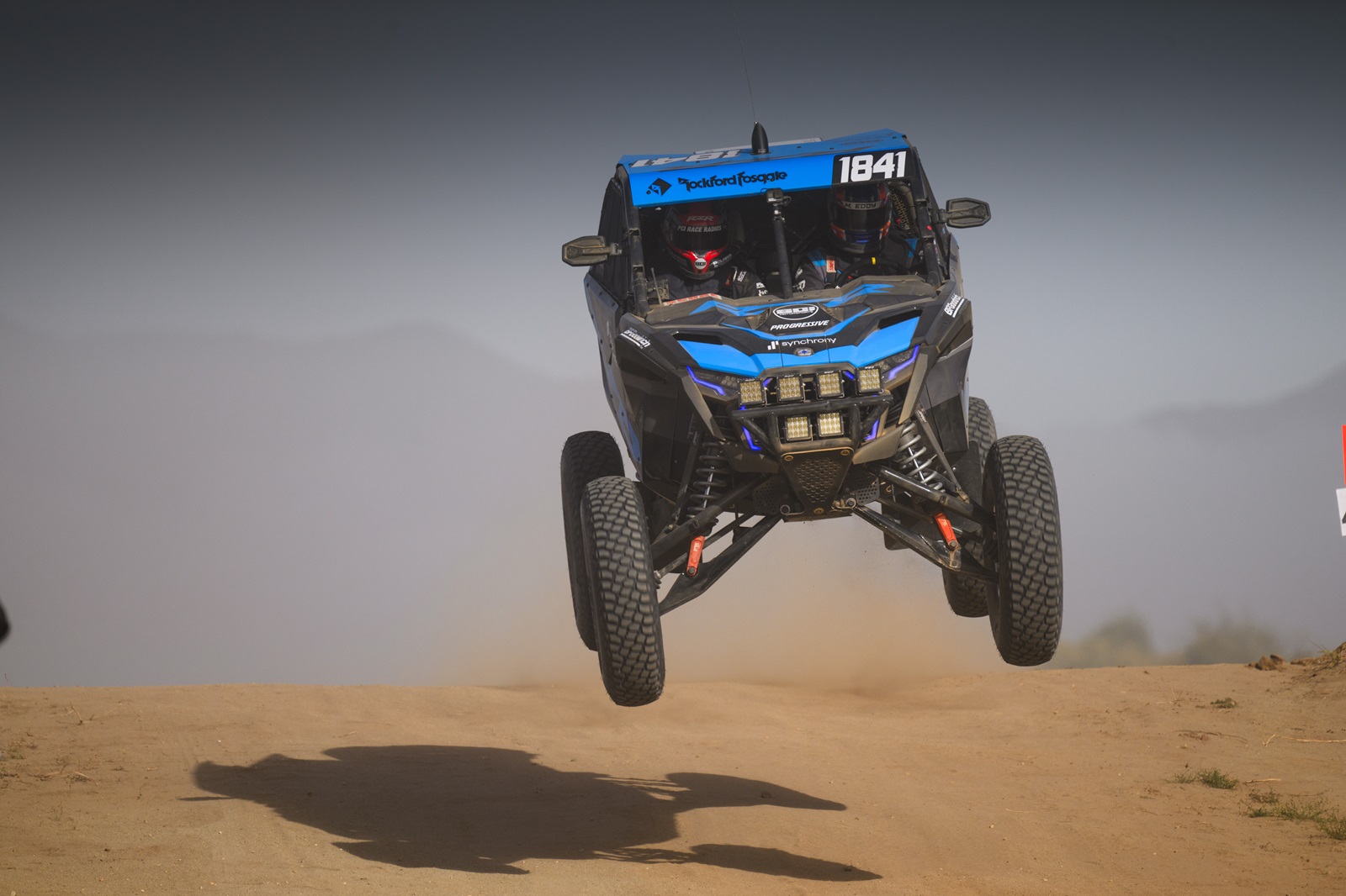 Polaris Factory Racing driver Max Eddy Jr. jumps over an obstacle.