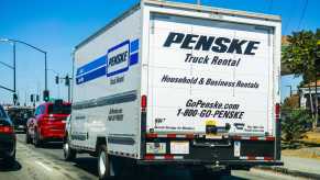 White Penske rental truck on the highway