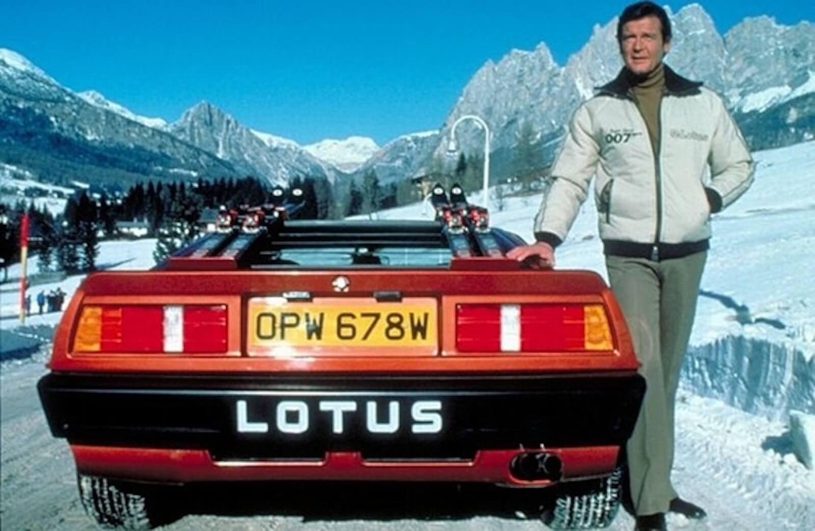 Sir Roger Moore stands beside the Lotus Esprit Turbo sports car for the James Bond movie "For Your Eyes Only."