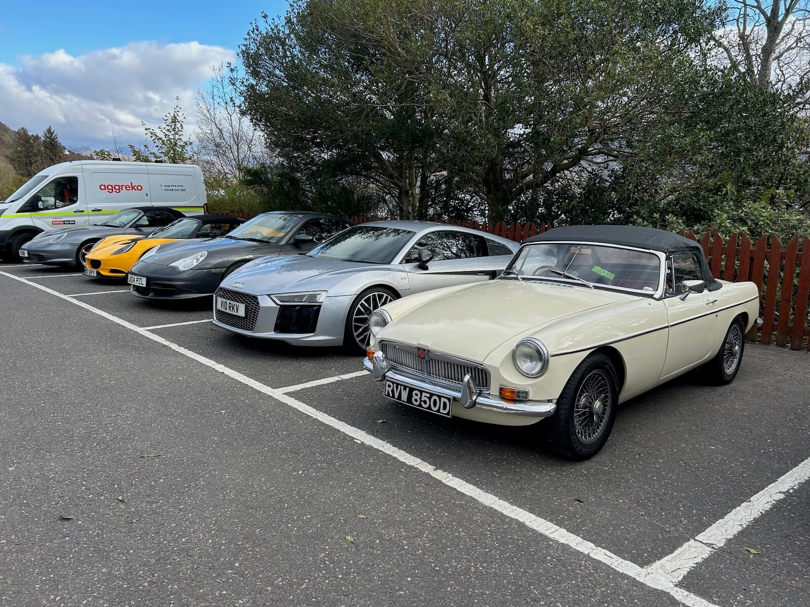 Performance and collector cars on a road trip at the Royal Hotel in Ullapool on the NC 500.
