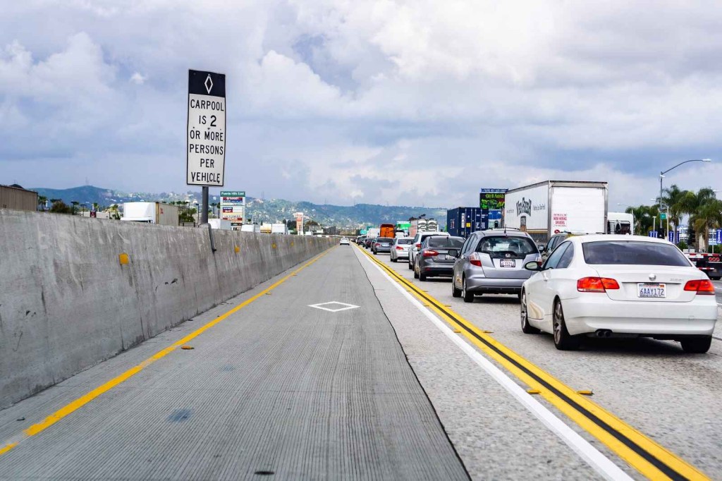 A car pool definition sign posted on a Los Angeles freeway