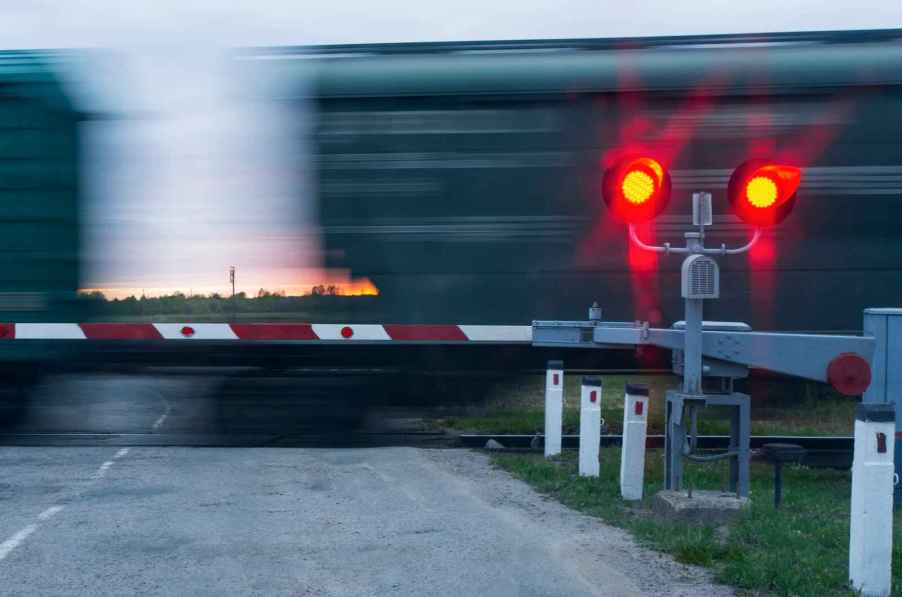 Railroad crossing train moving fast