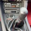The stick shift lever in a 1992 Dodge Stealth.