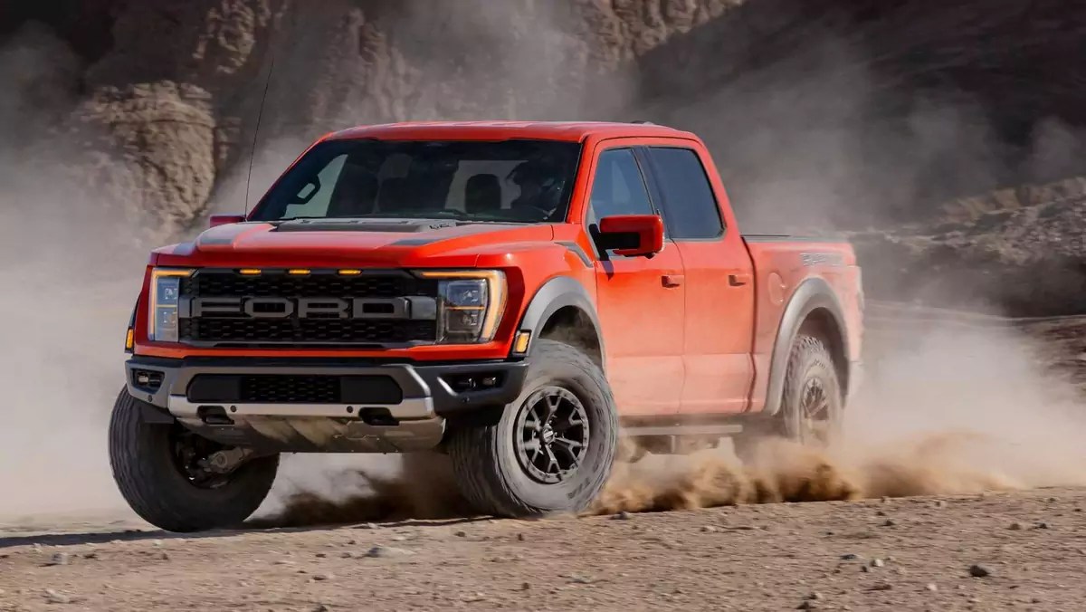 The 2024 Ford F-150 Raptor kicking up dirt