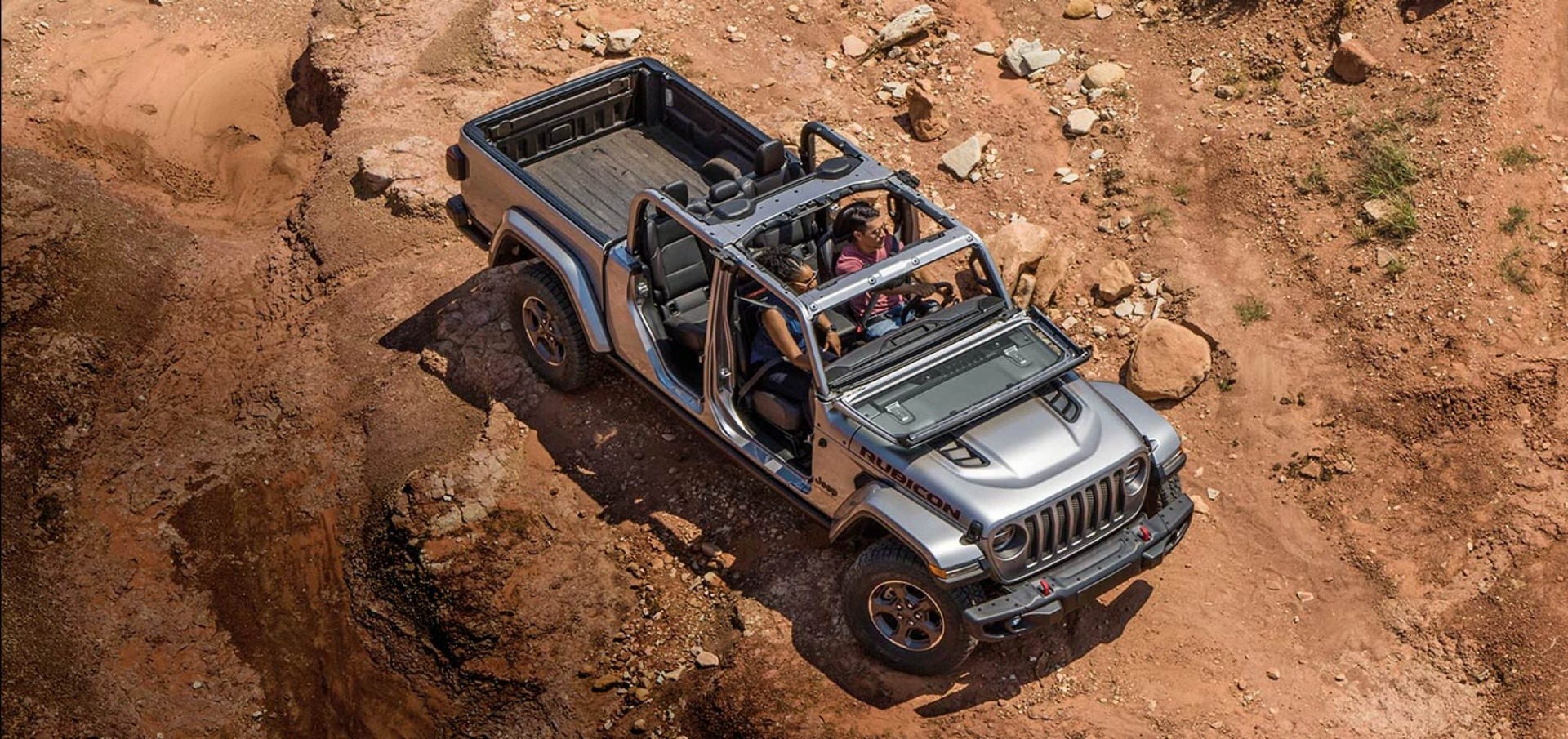 The 2024 Jeep Gladiator off-roading with the top off 