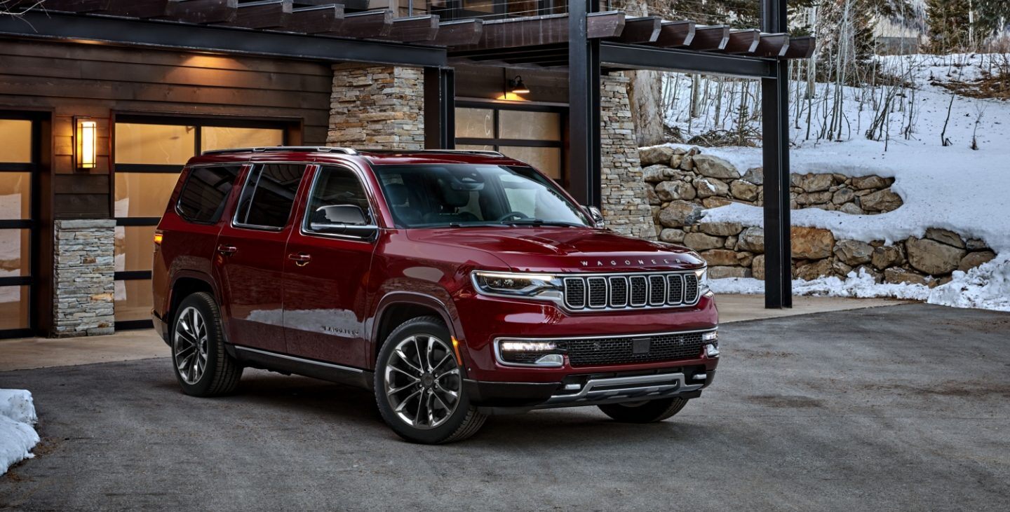 The 2024 Jeep Wagoneer parked near a home