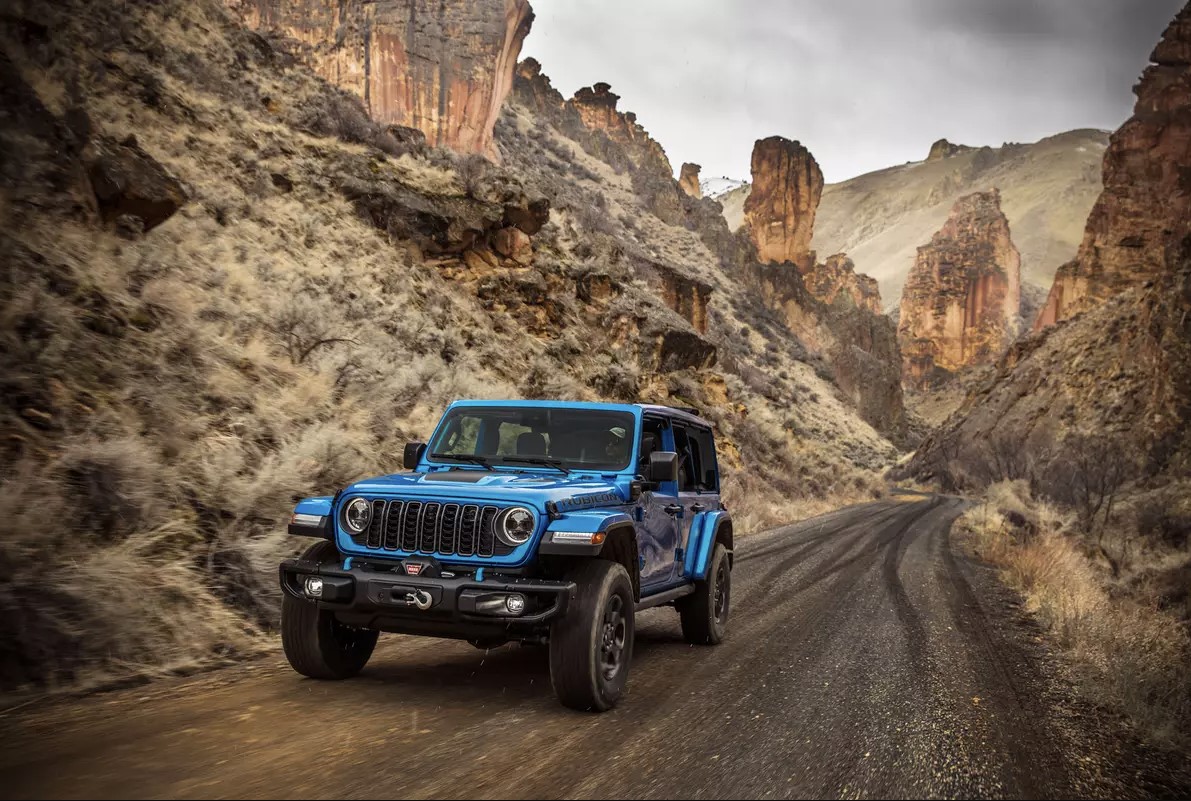 The 2024 Jeep Wrangler 4xe on a dirt road