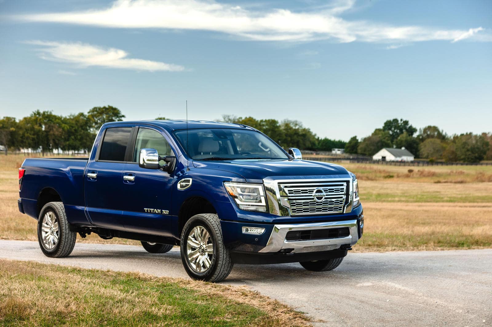 The 2024 Nissan Titan on a rural road