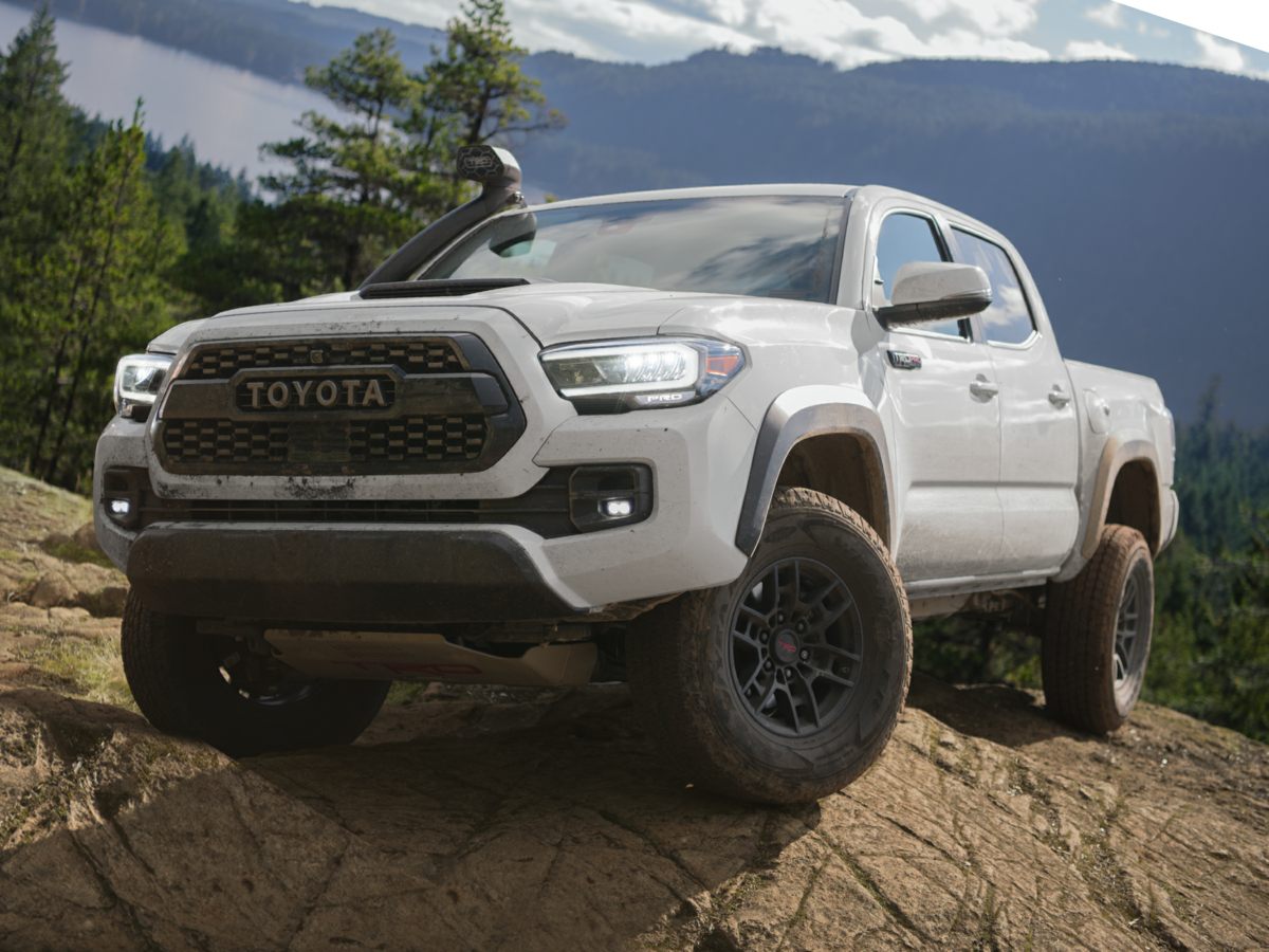 The 2023 Toyota Tacoma climbing over rocks
