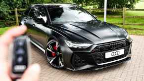 Audi owner clicks the key fob to unlock the luxury sedan's doors.