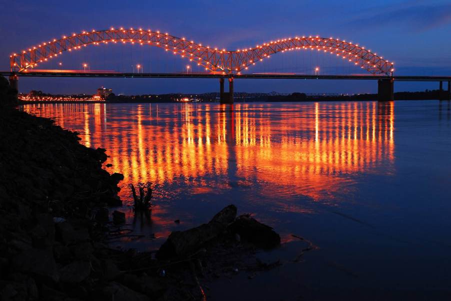 The lgihts on a bridge in Memphis, Tennessee, reflected in the Mississippi river.