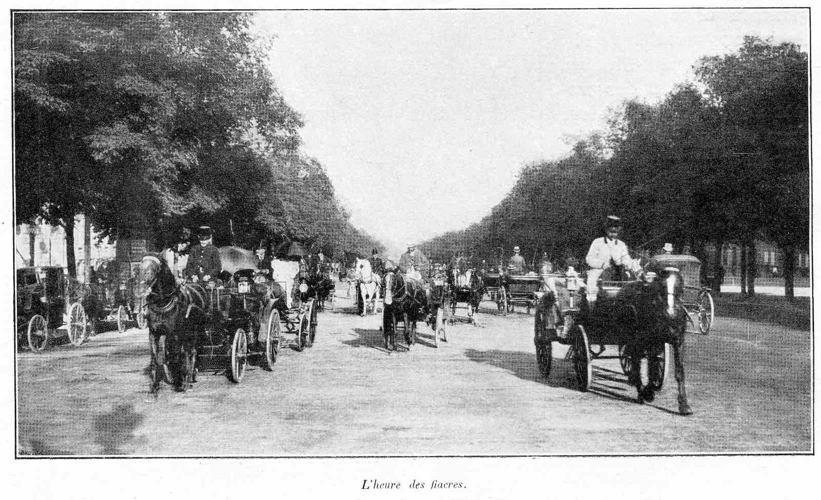 Carriages travel through a park in Paris in the 1890s