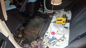 A car like the models damaged by New York City rats showcases rodent damage.