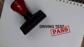 Large blank spiraled notepad with "Driving Test" written next to a stamp, "PASS" is stamped in all caps, the Minnesota DVS is weeks or even months behind its appointment queues