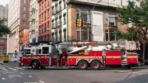 An FDNY fire truck parked in full left profile view