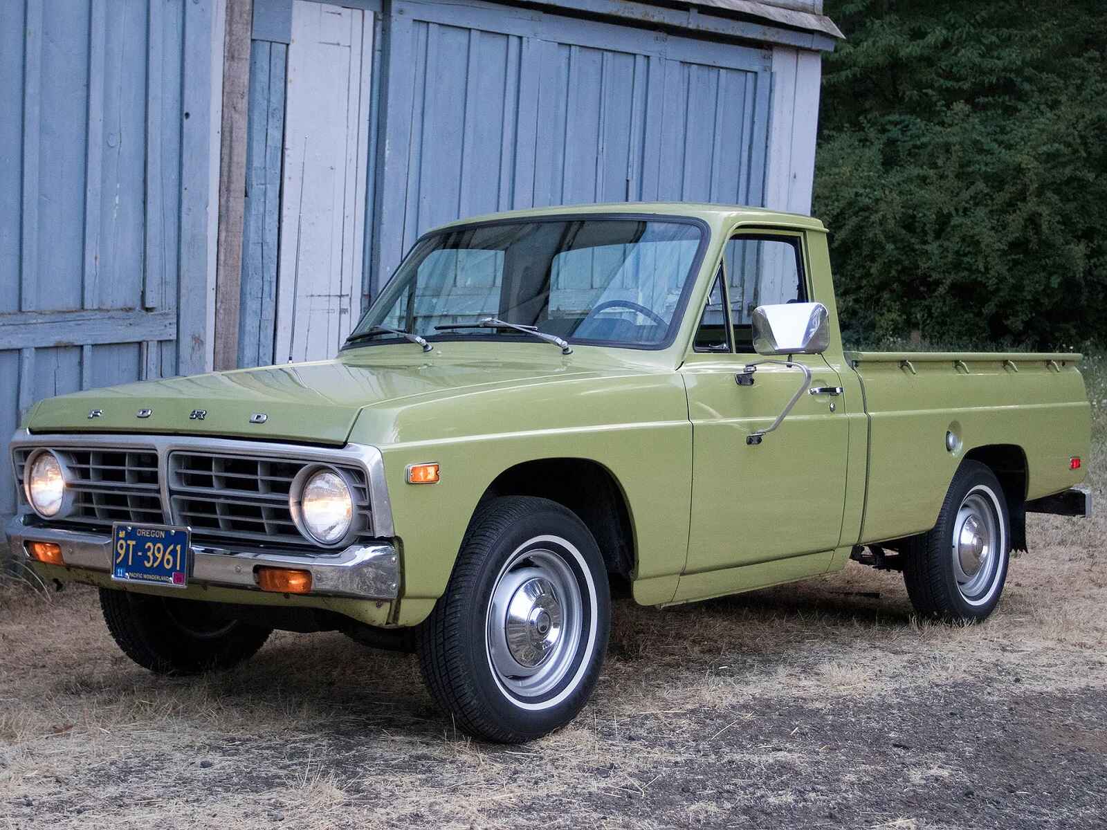A green 1974 Ford Courier truck