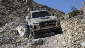 The 2024 Chevy Colorado off-roading over rocky terrain