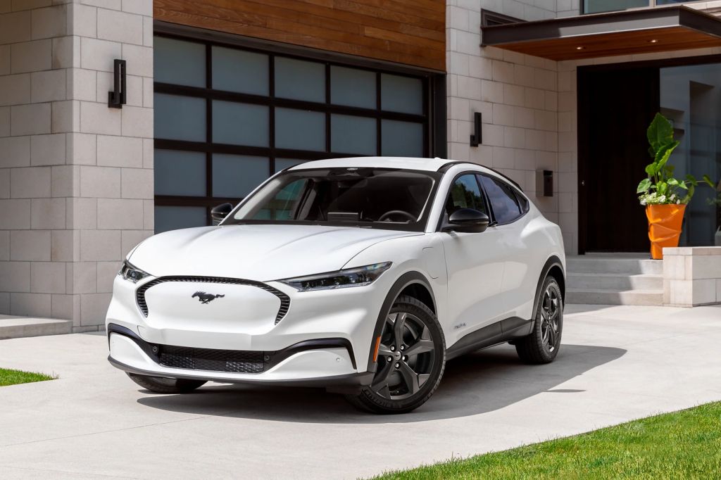 The 2024 Ford Mustang Mach-E parked near a home