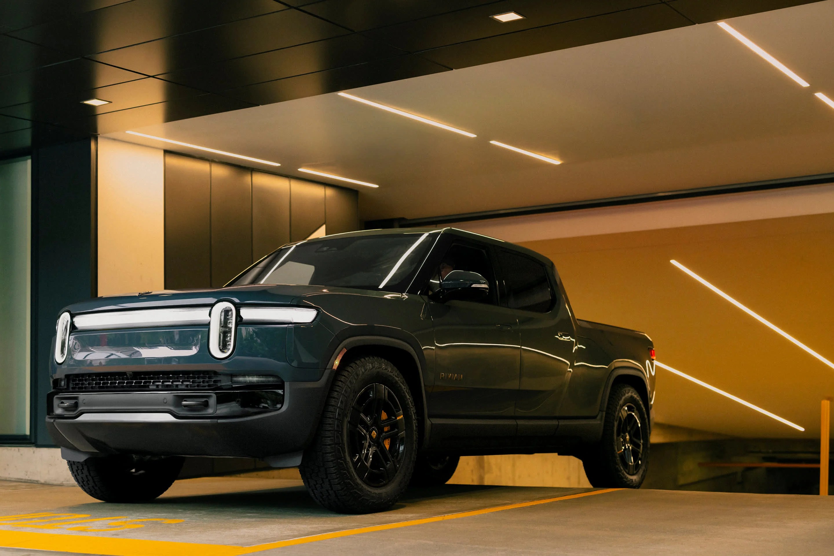 The 2024 Rivian R1T in a parking garage