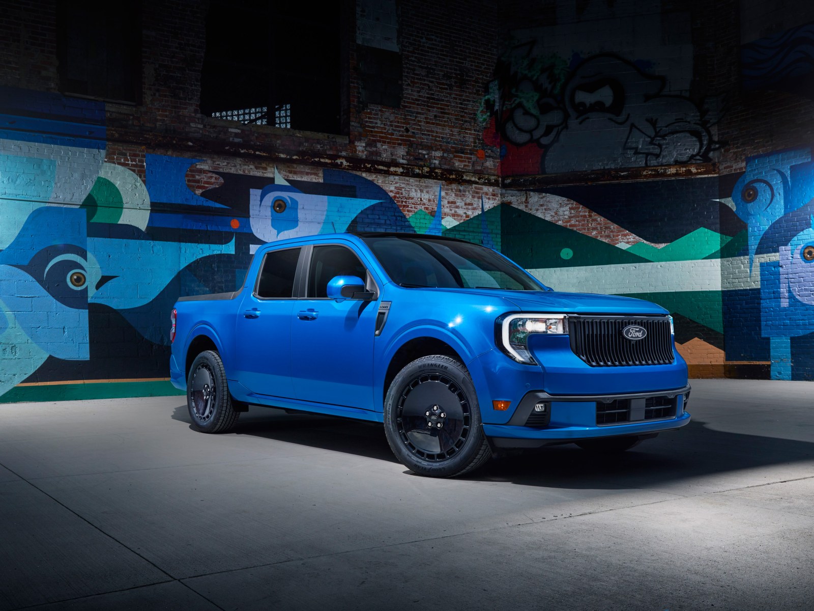 The 2025 Ford Maverick Lobo in front of graffiti