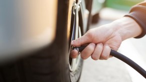 Using an air compressor to inflate tires.