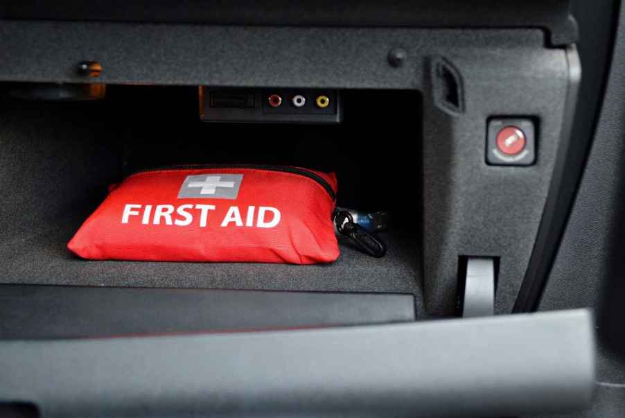 A car emergency medical kit in a vehicle glove box