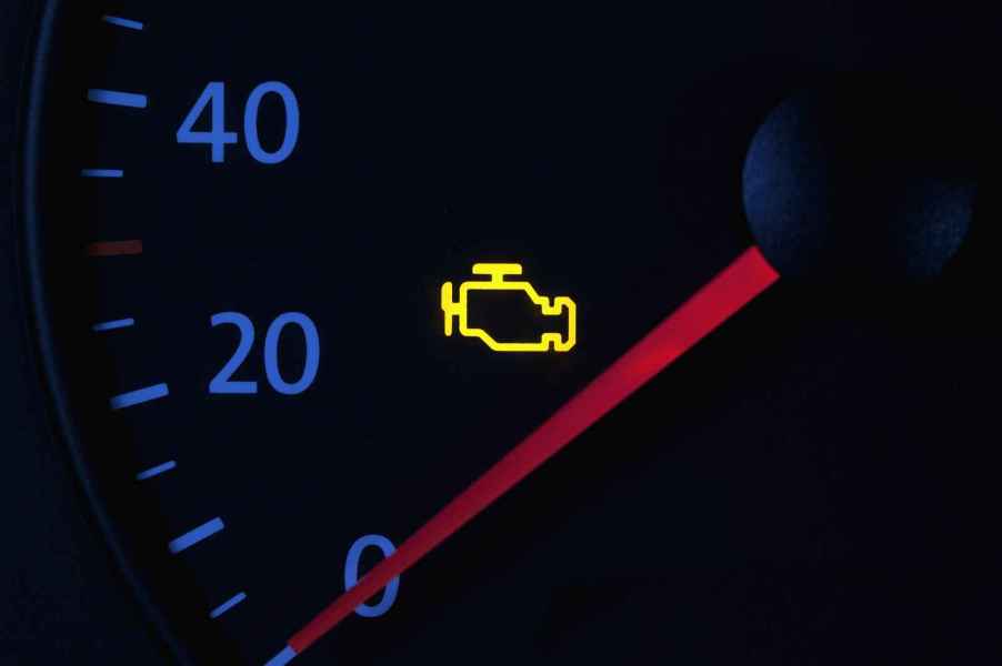 A yellow check engine light in close view a check engine light flashing means severe damage is possible