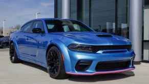 A blue 2023 Dodge Charger SRT Hellcat parked in right front angle view is one of the most expensive for car insurance companies to fully cover