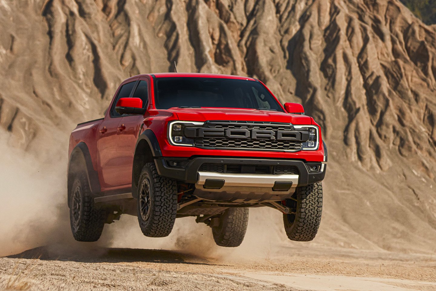 The 2024 Ford Ranger Raptor jumping in the desert