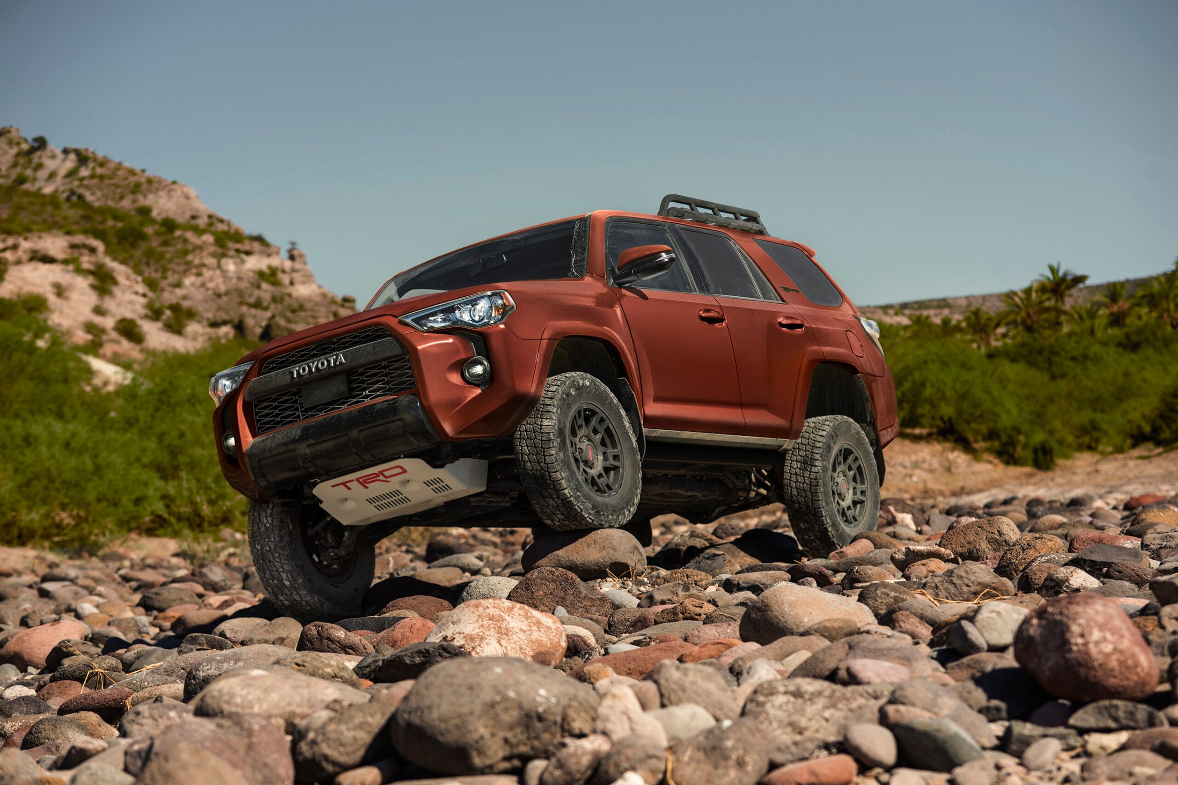 The 2024 Toyota 4Runner climbing over rocks