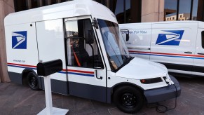 The USPS Next Generation Delivery Vehicle built by Oshkosh Defense parked in right side angle view