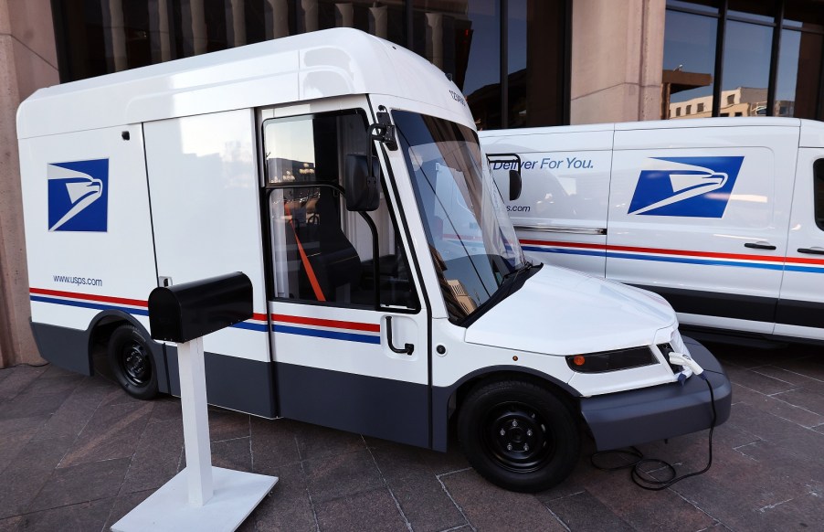 The USPS Next Generation Delivery Vehicle built by Oshkosh Defense parked in right side angle view