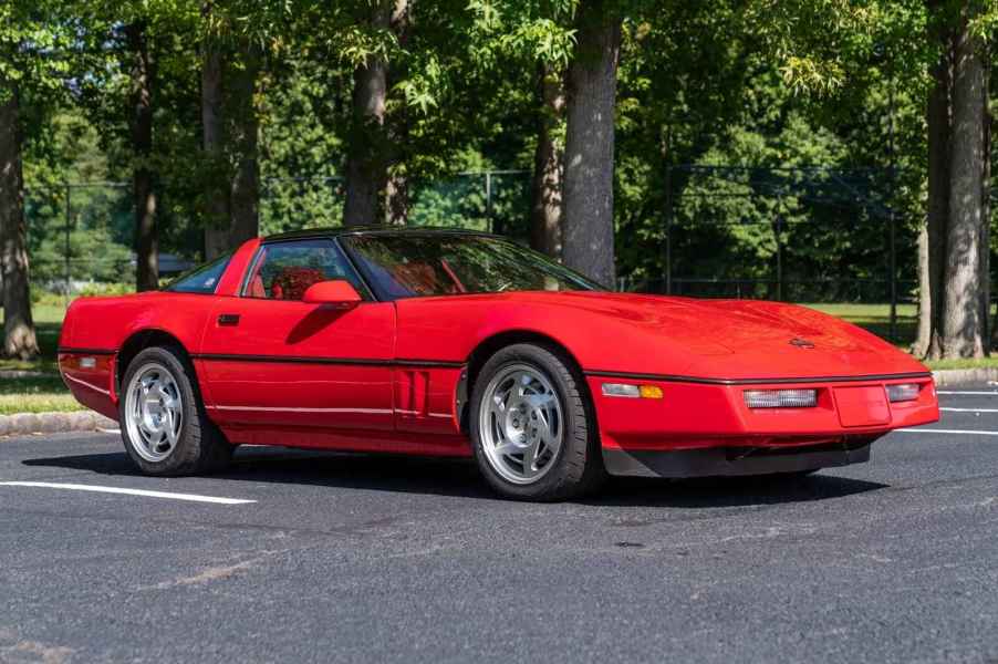 A 1990 Chevrolet Corvette ZR-1 in Bright Red parked outside in right front angle view