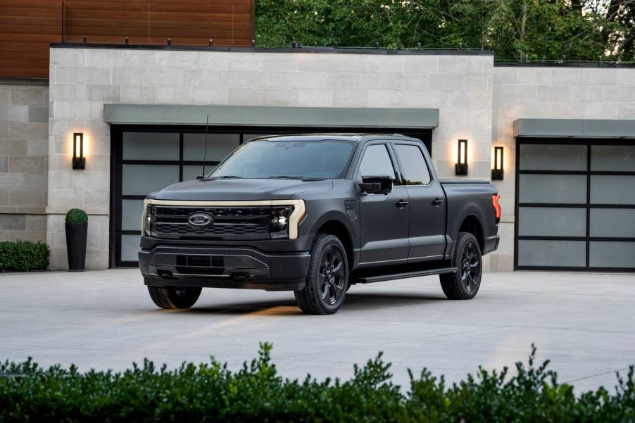 The 2024 Ford F-150 Lightning in front of a house