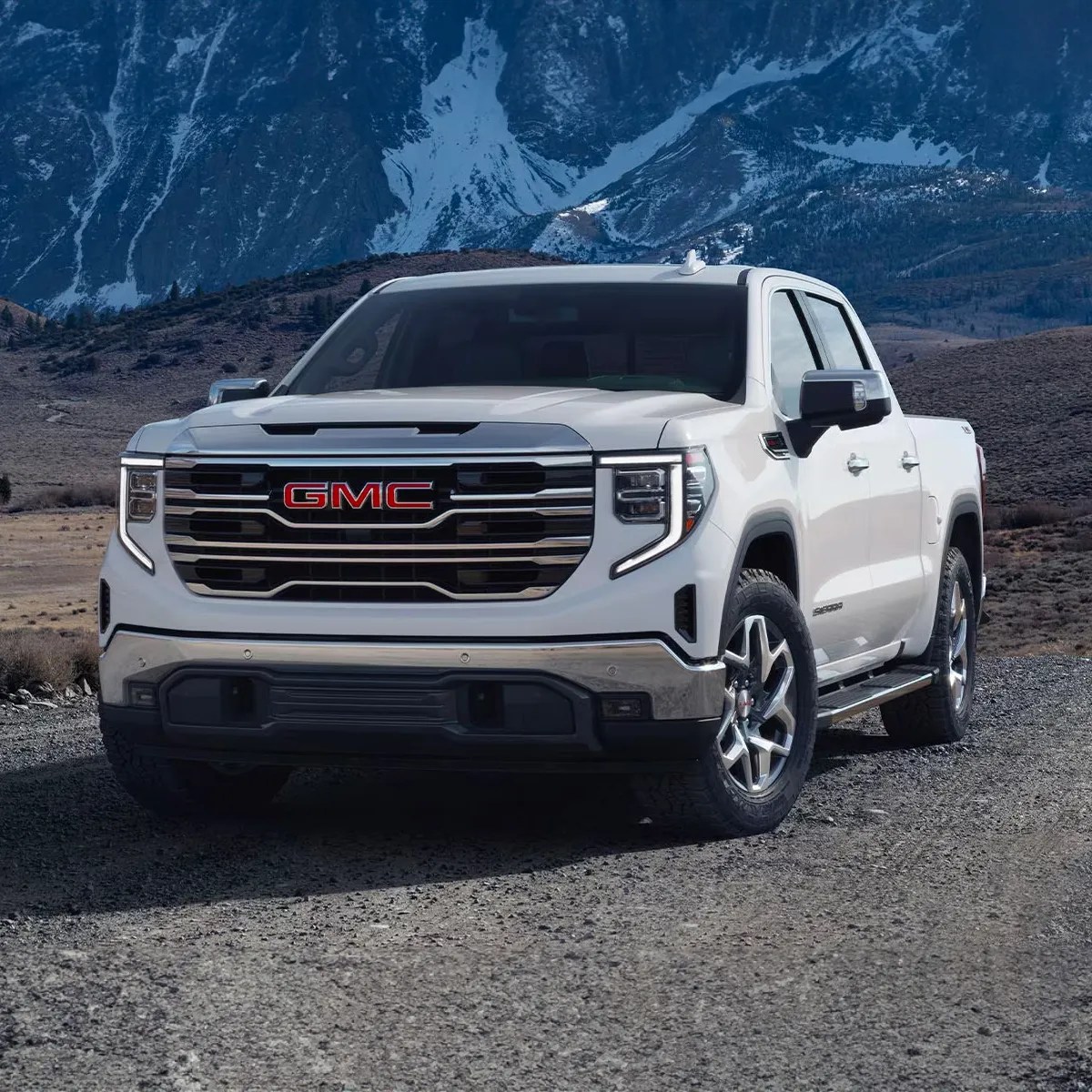 The 2024 GMC Sierra 1500 off-roading in the mountains