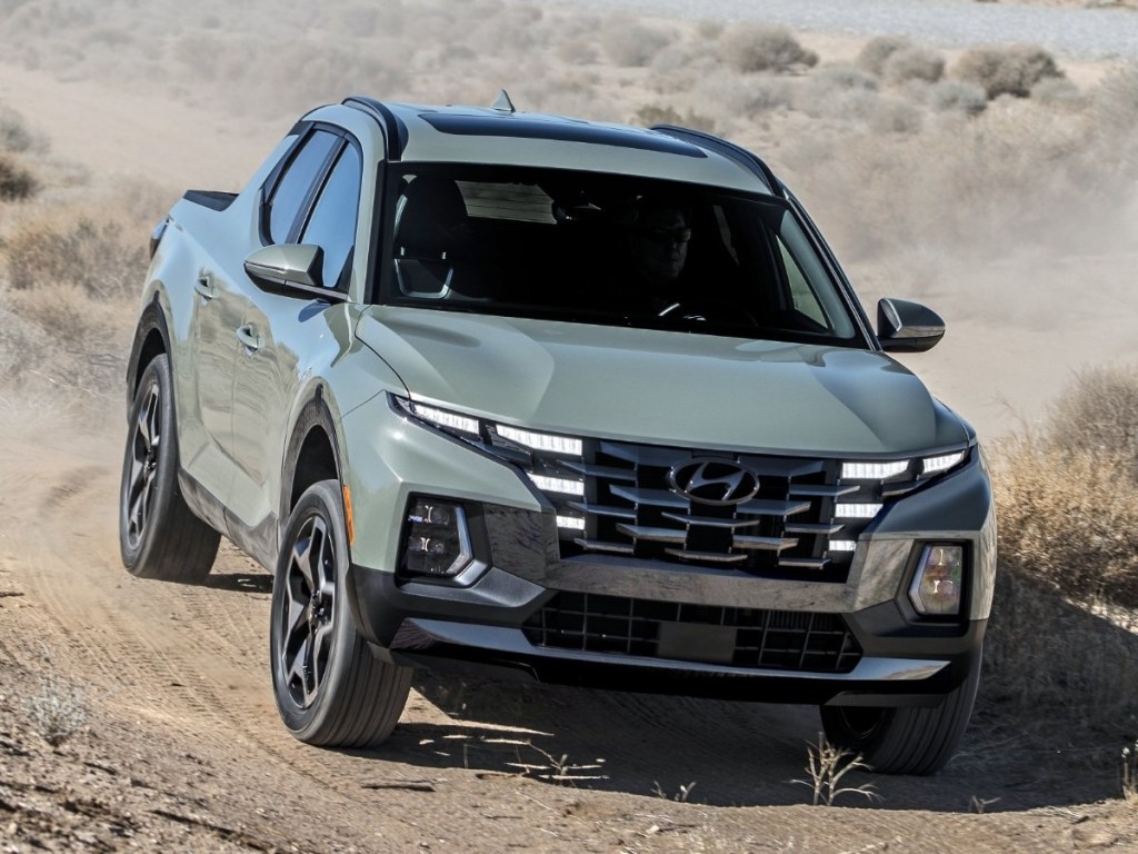 The 2024 Hyundai Santa Cruz off-roading in dirt
