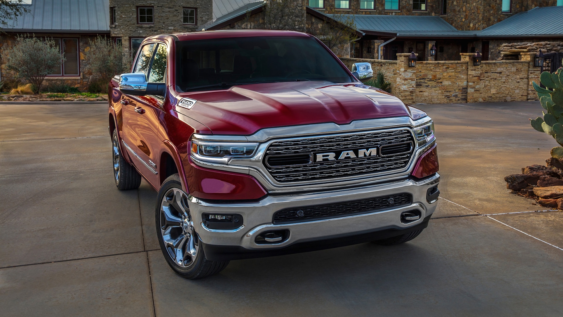 The 2024 Ram 1500 parked near a home