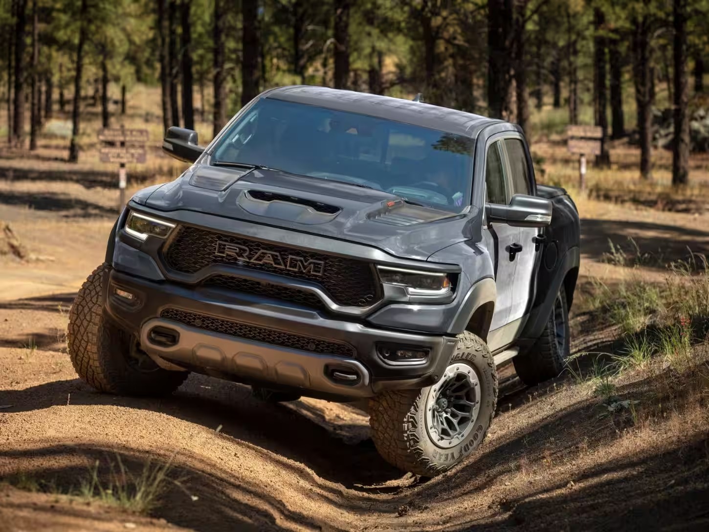 The 2024 Ram 1500 off-roading in the woods 